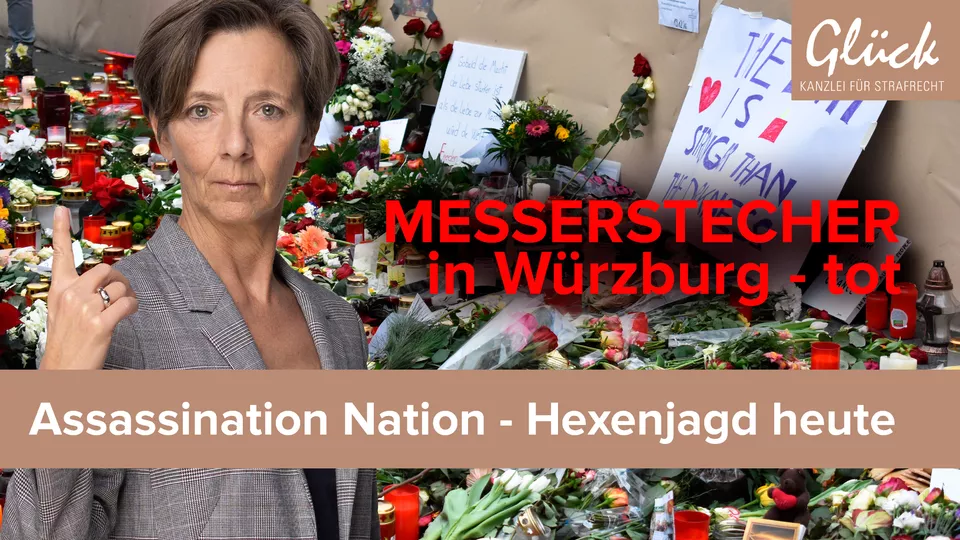 Grablichter und Blumen an einem Tatort nach einer Messerattake
